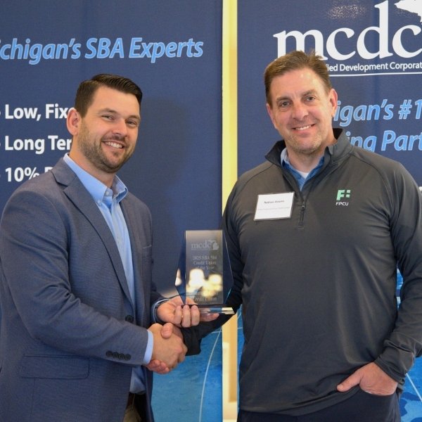 Nathan Adams accepted Financial Plus Credit Union’s 2025 Credit Union of the Year award