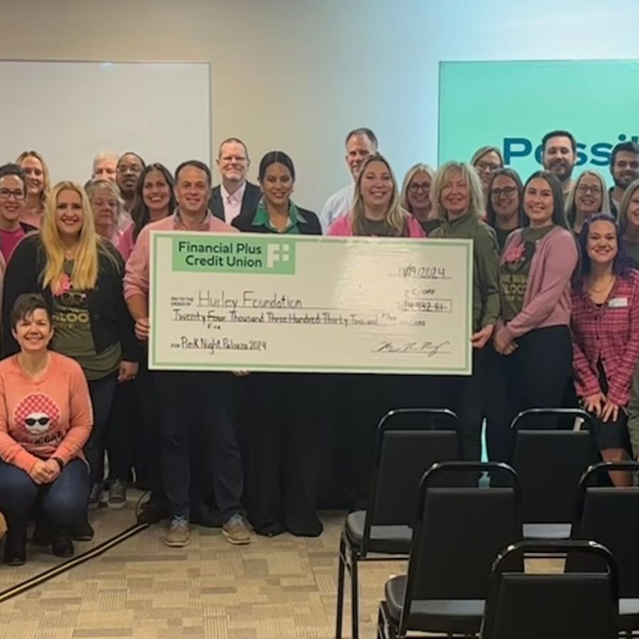 Financial Plus staff team present the Hurley Foundation with a $24,000 check for Pink Night Palooza's 2024 campaign